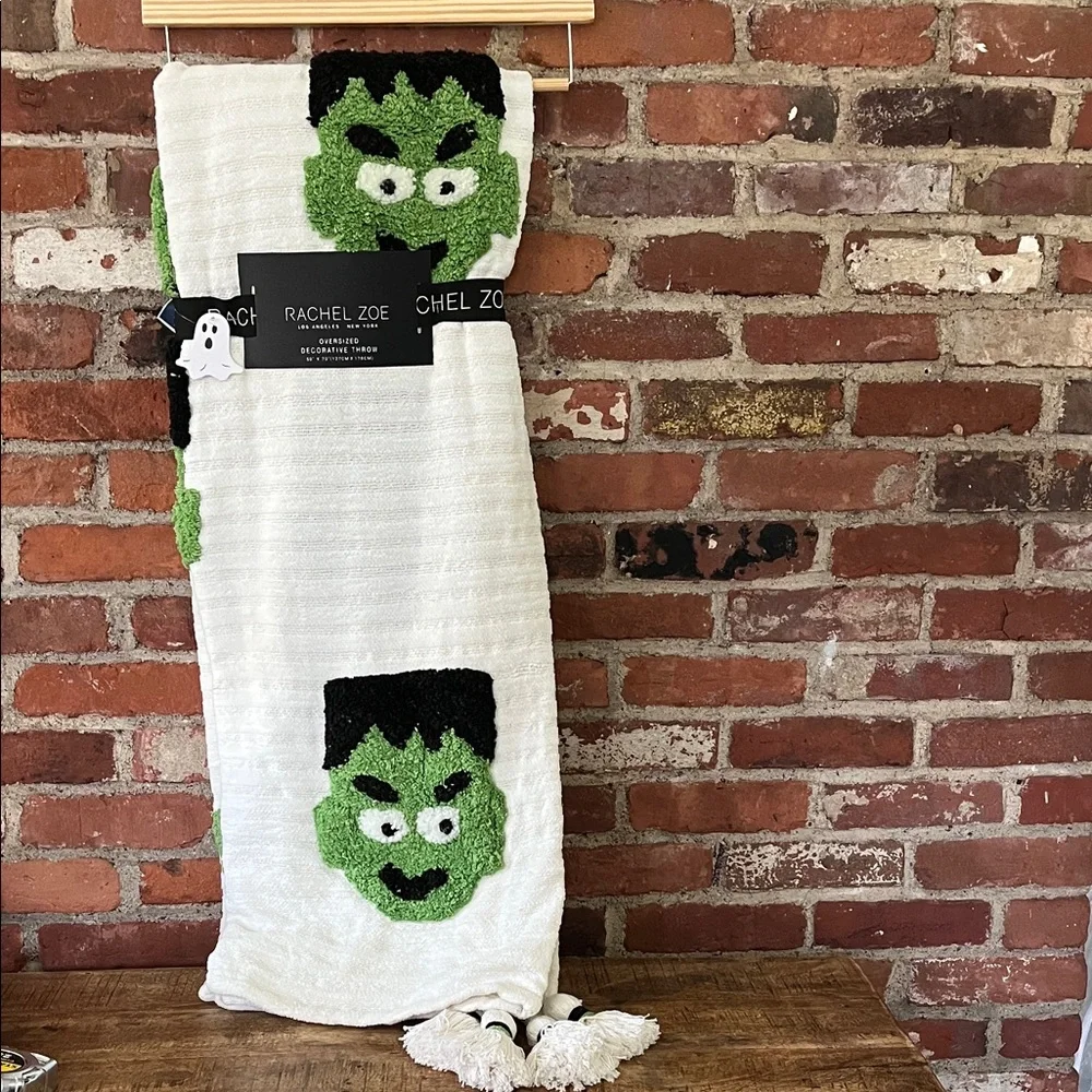 Rachel Zoe White Throw with Green Monster Design